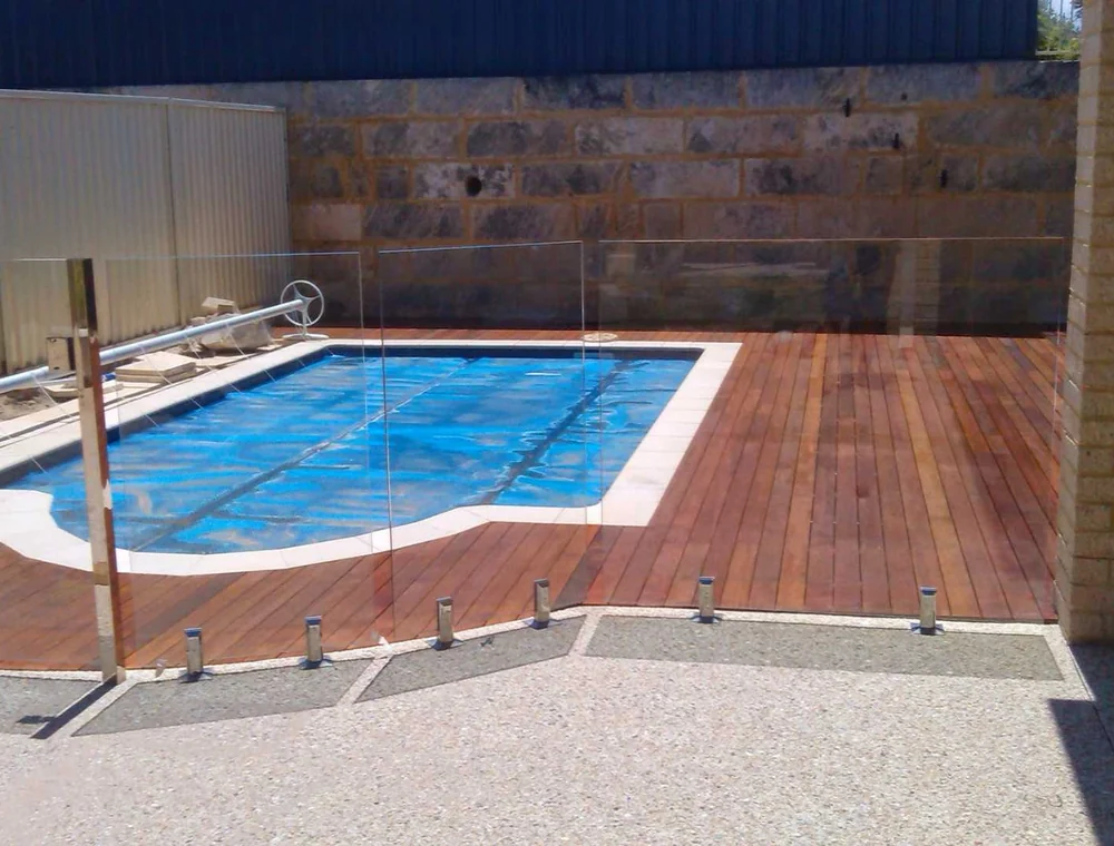 Timber pool deck with glass pool fencing, a Seaforth Builders project on the Gold Coast