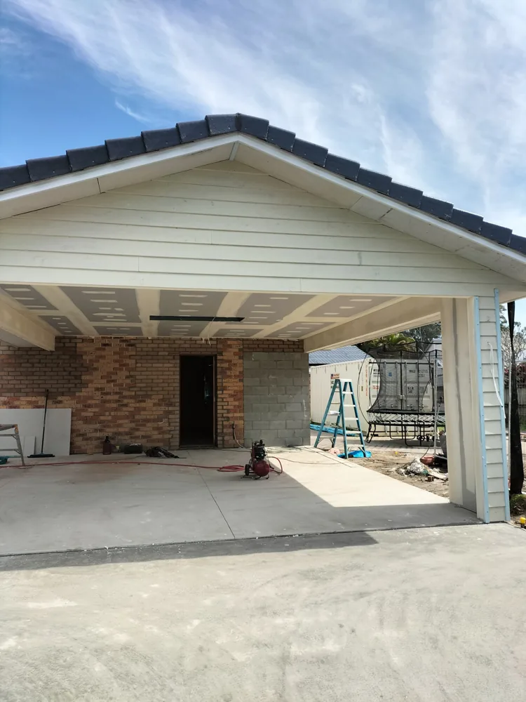 Gabled tiled-roof carport under construction, a Seaforth Builders project on the Gold Coast