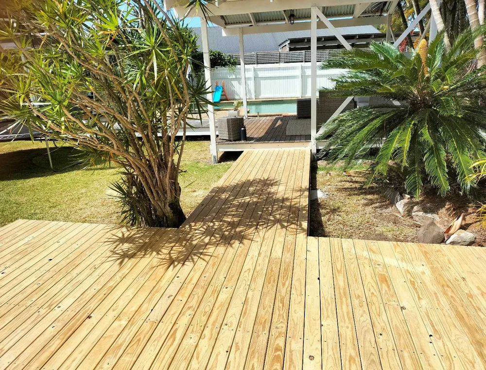 Timber deck and walkway through a landscaped yard, a Seaforth Builders project on the Gold Coast
